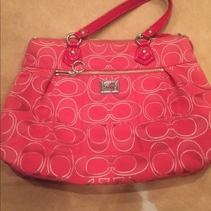 Red coach purse with wallet.